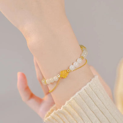 Peach Blossom Hotan Jade Hand-String Bracelet — Romance & Protection