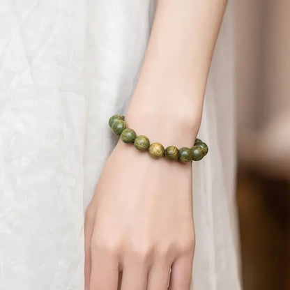 Green Sandalwood Lotus Cinnabar Bracelet — Wealth & Blessing