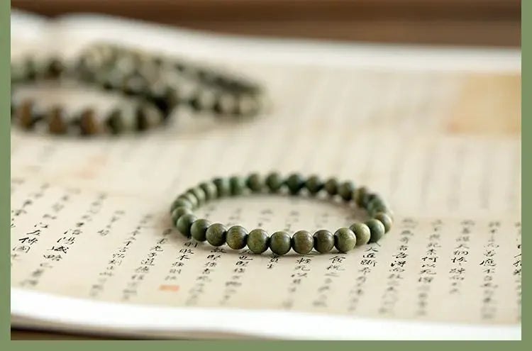 Green Sandalwood Lotus Cinnabar Bracelet — Wealth & Blessing