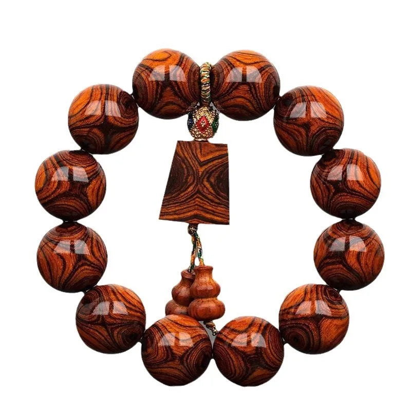 Hainan Sea-Yellowwood Bracelet — Ghost-Eye Grain Carving