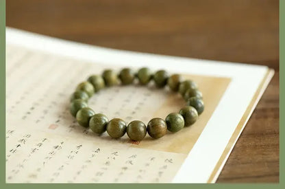 Green Sandalwood Lotus Cinnabar Bracelet — Wealth & Blessing