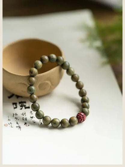 Green Sandalwood Lotus Cinnabar Bracelet — Wealth & Blessing