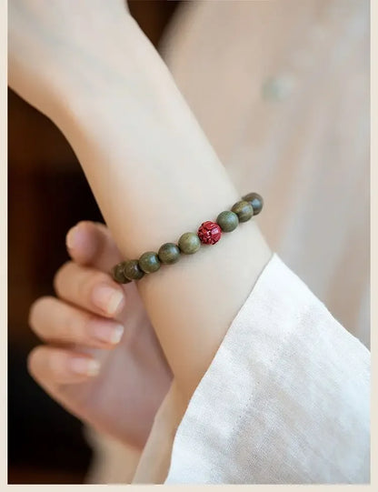 Green Sandalwood Lotus Cinnabar Bracelet — Wealth & Blessing