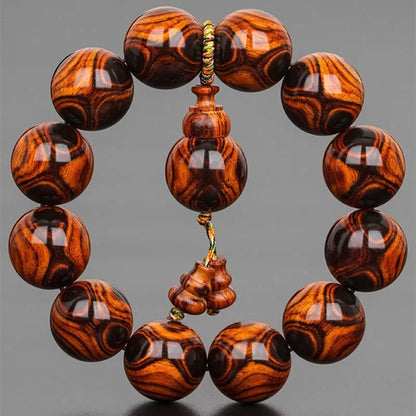 Hainan Sea-Yellowwood Bracelet — Ghost-Eye Grain Carving