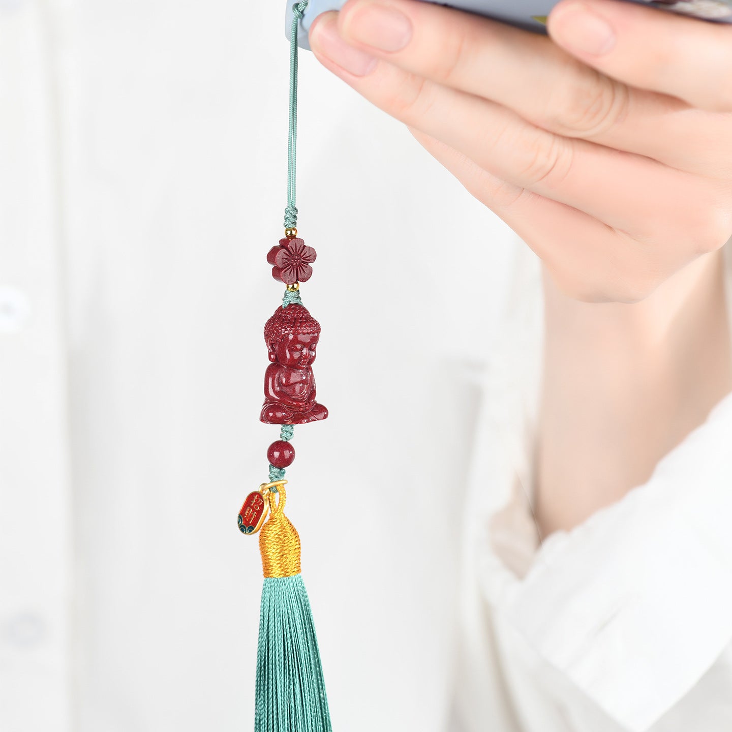 Natural Purple Gold Cinnabar Infant Buddha Charm with Handwoven Tassel for Phone & Bag